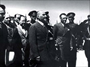 1938 – Mersin seyahatinde Vali Rüknettin Nasuhioğlu (sol başta) ve tören birliği tarafından karşılanışı